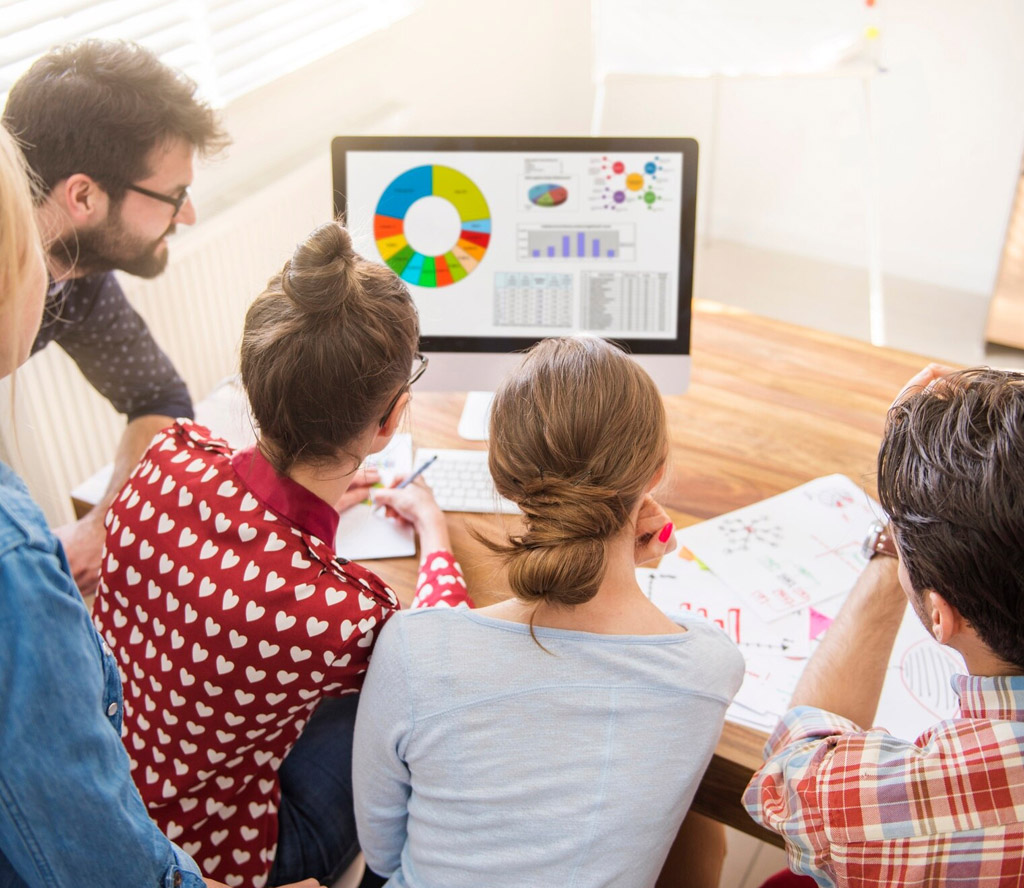 Team-reviewing-website-performance-metrics-and-data-charts-photo